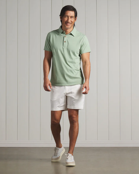 A man wearing a Grayers pima cotton polo - basil