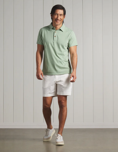 A man wearing a Grayers pima cotton polo - basil