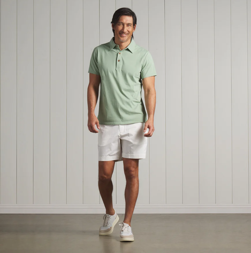 A man wearing a Grayers pima cotton polo - basil