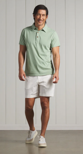 A man wearing a Grayers pima cotton polo - basil