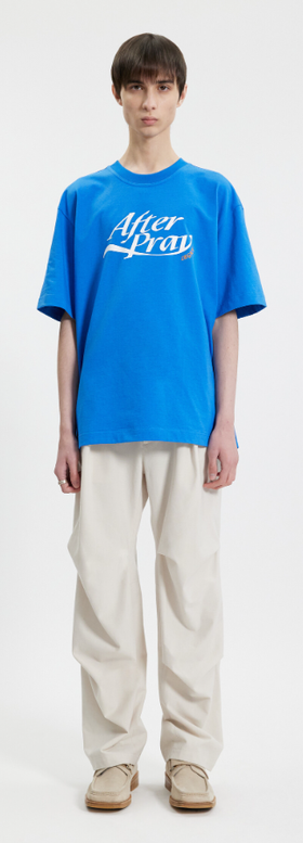 A man wearing a After Pray essential logo legacy printed t-shirt blue
