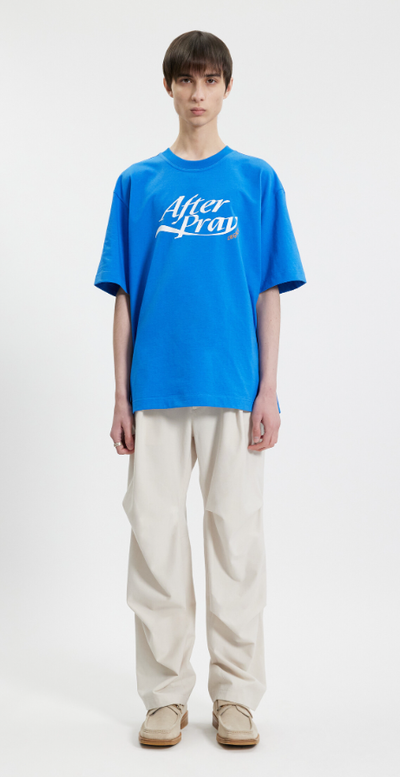 A man wearing a After Pray essential logo legacy printed t-shirt blue