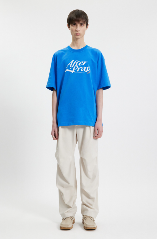 A man wearing a After Pray essential logo legacy printed t-shirt blue