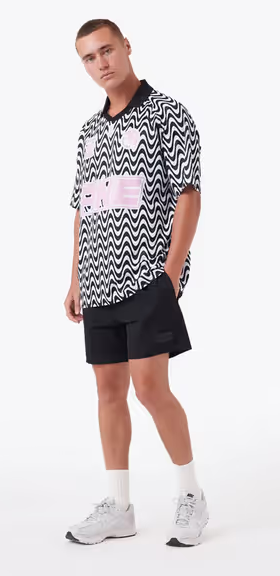 A man wearing a Zanerobe zr football shirt black/pink