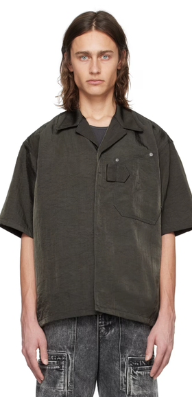 A man wearing a OUAT gray work shirt
