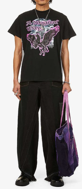 A man wearing a Liam Hodges magical way tee and black unified jeans
