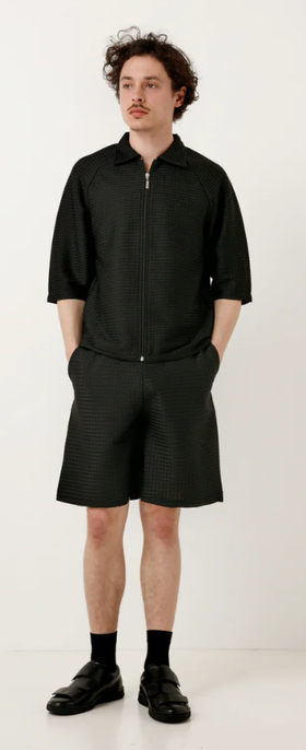 A man wearing a Cottweiler service shorts black