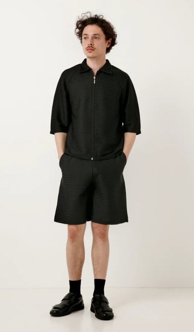 A man wearing a Cottweiler service shorts black