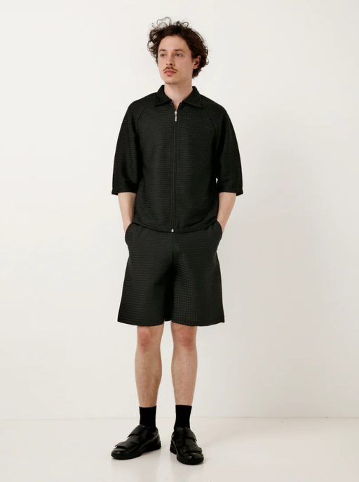 A man wearing a Cottweiler service shorts black