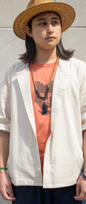 A woman wearing Kiriko ennichi shirt, dabo, white