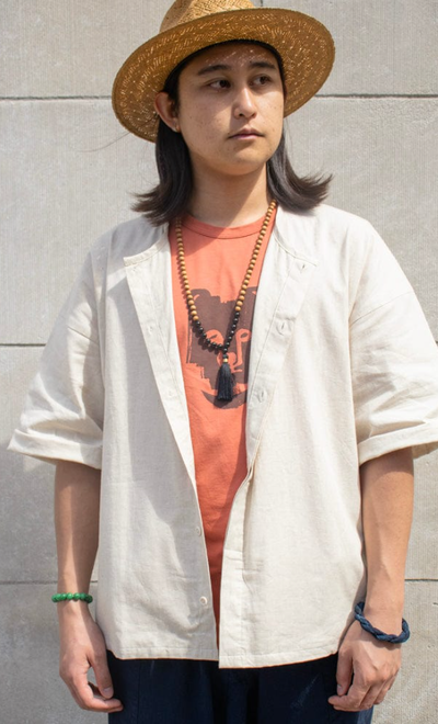 A woman wearing Kiriko ennichi shirt, dabo, white