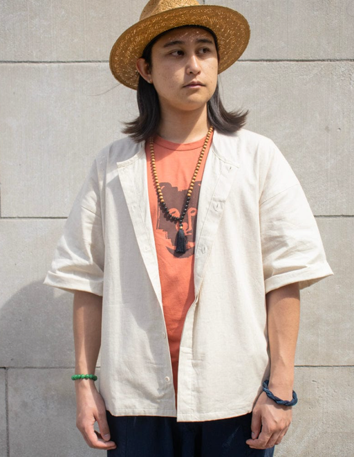 A woman wearing Kiriko ennichi shirt, dabo, white