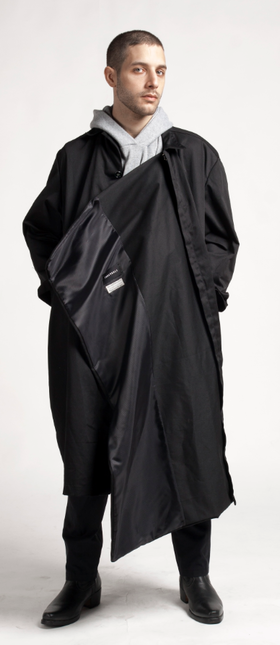 A man wearing Proudrace extended lining studio coat and deconstructed hoodie scarf