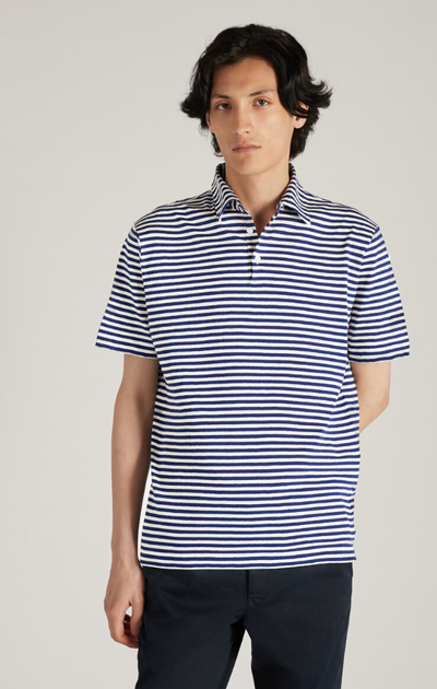 A man wearing Incotex slim-fit polo shirt in certified linen and cotton jersey - grey/bluette