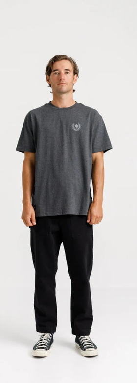 A man wearing a Thing Thing ample tee - coal marl collegiate print