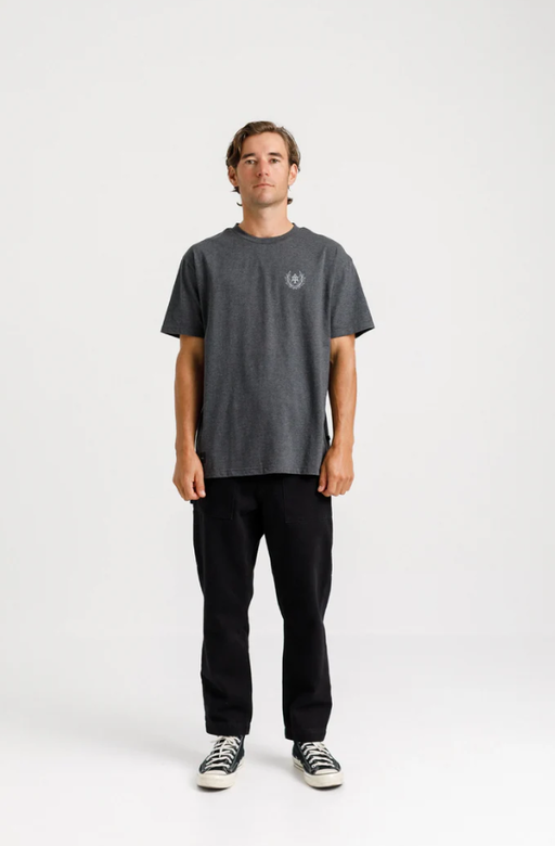 A man wearing a Thing Thing ample tee - coal marl collegiate print