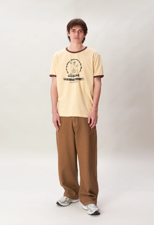 A man wearing a Checks New Zealand ringer t-shirt