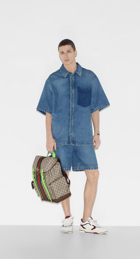 A man carrying Gucci Kids ophidia gg medium backpack