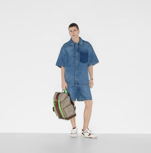 A man carrying Gucci Kids ophidia gg medium backpack