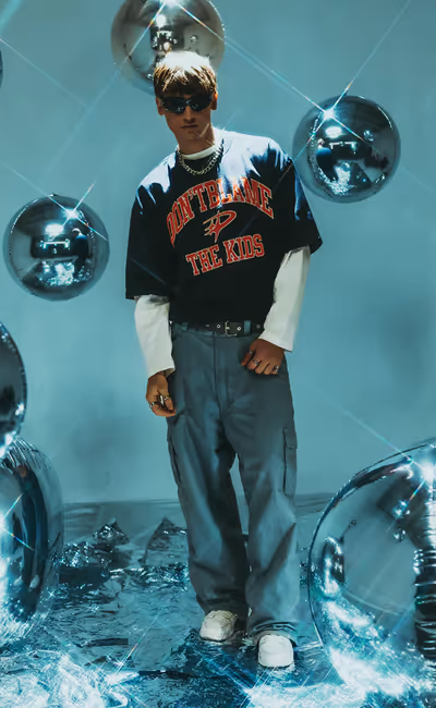 A man wearing DBTK arc tee - navy blue