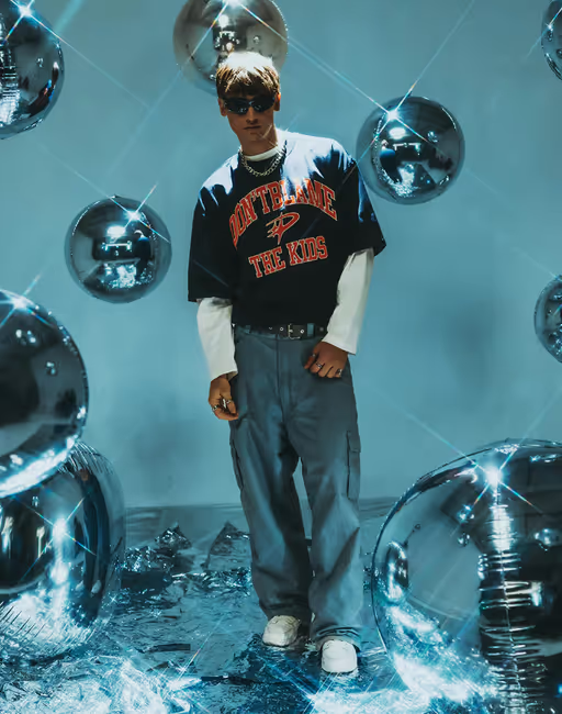 A man wearing DBTK arc tee - navy blue