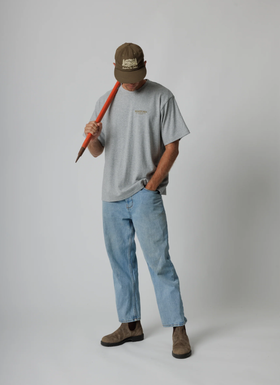 A man wearing a Moreporks grey mountain society tee