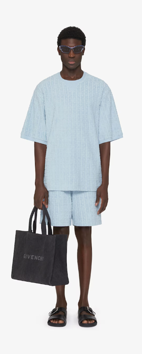A man wearing Givenchy Kids t-shirt in 4g cotton towelling