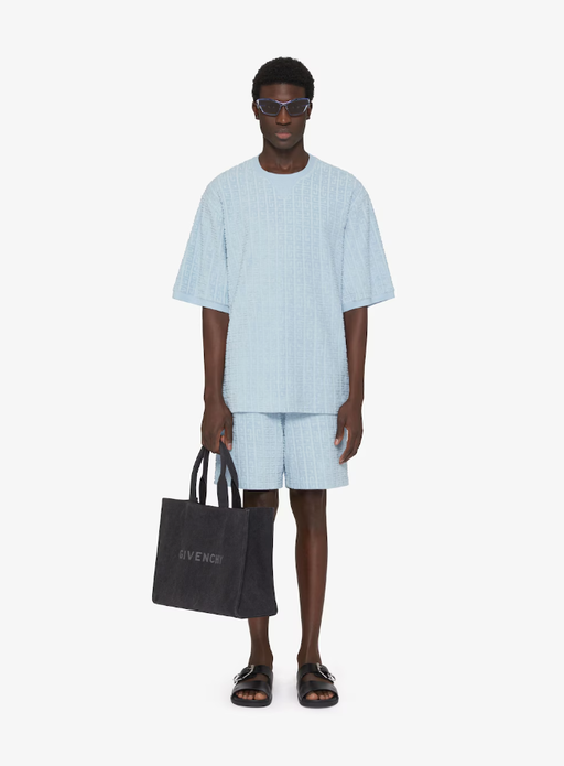 A man wearing Givenchy Kids t-shirt in 4g cotton towelling