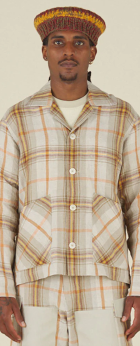 A man wearing Nicholas Daley 3 pocket collared cardigan - nd summer tartan