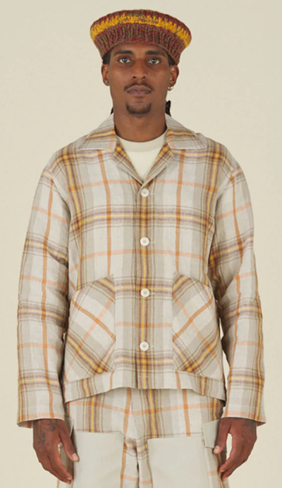 A man wearing Nicholas Daley 3 pocket collared cardigan - nd summer tartan