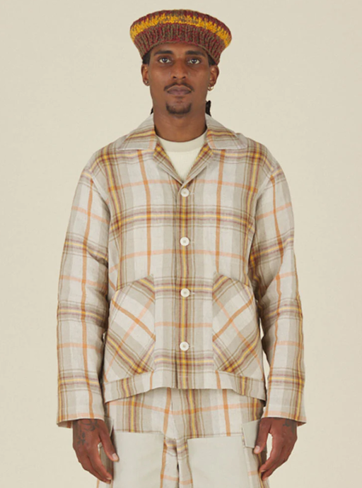 A man wearing Nicholas Daley 3 pocket collared cardigan - nd summer tartan