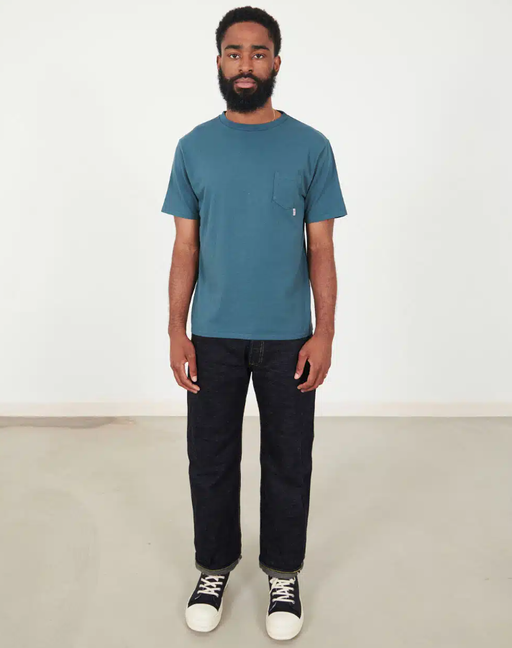 A man wearing Those That Know riding high standard pack pocket tee – blue