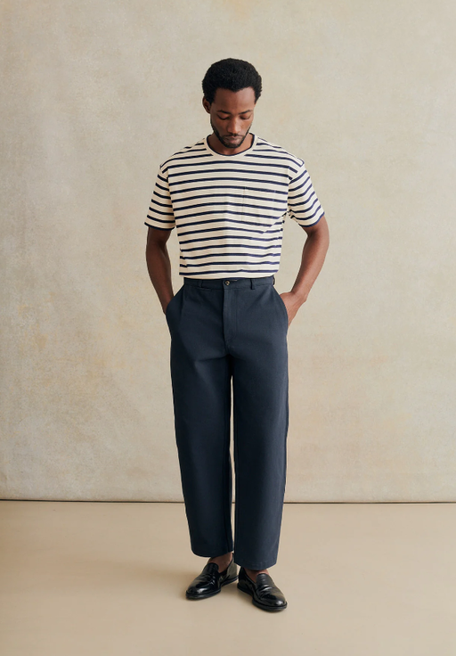 A man wearing De Bonne Facture stripe oversized t-shirt