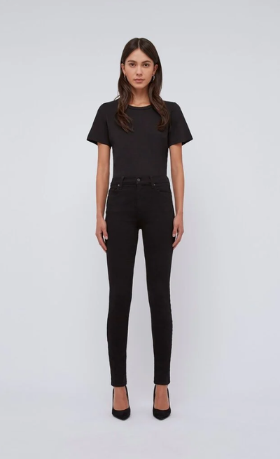 A woman wearing Baldwin Denim baldwin ultra high rise skinnyjean