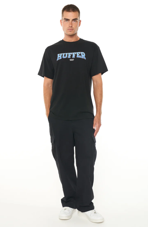 A man wearing a Huffer mens sup tee/graded black