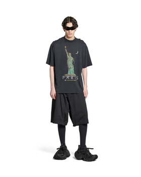 A man wearing Balenciaga Kids paris liberty t-shirt medium fit in black