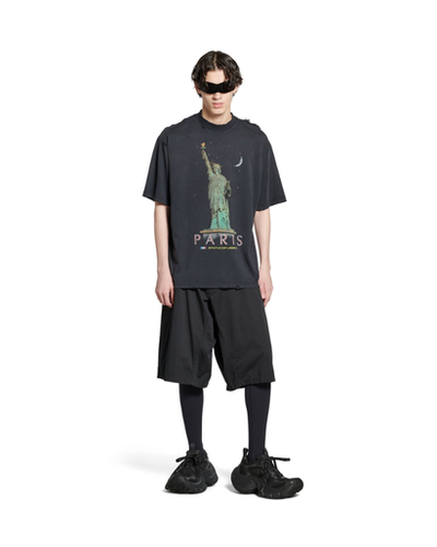 A man wearing Balenciaga Kids paris liberty t-shirt medium fit in black