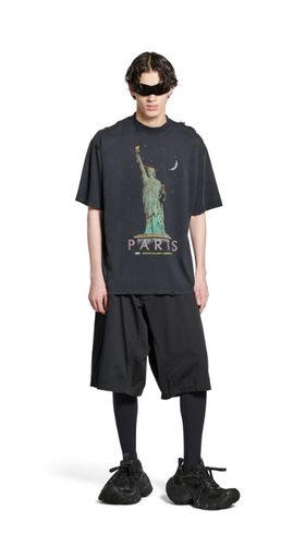 A man wearing Balenciaga Kids paris liberty t-shirt medium fit in black