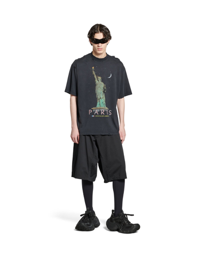 A man wearing Balenciaga Kids paris liberty t-shirt medium fit in black