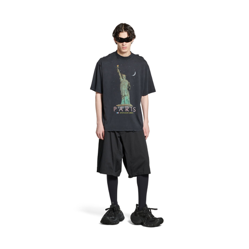 A man wearing Balenciaga Kids paris liberty t-shirt medium fit in black