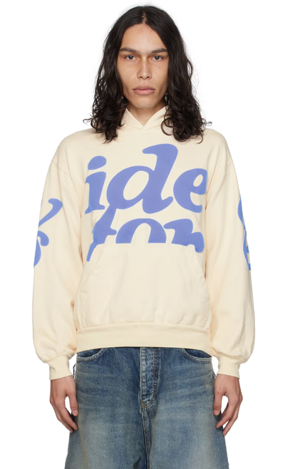 A man wearing VIDEO STORE APPAREL video store apparel off-white mega puff hoodie