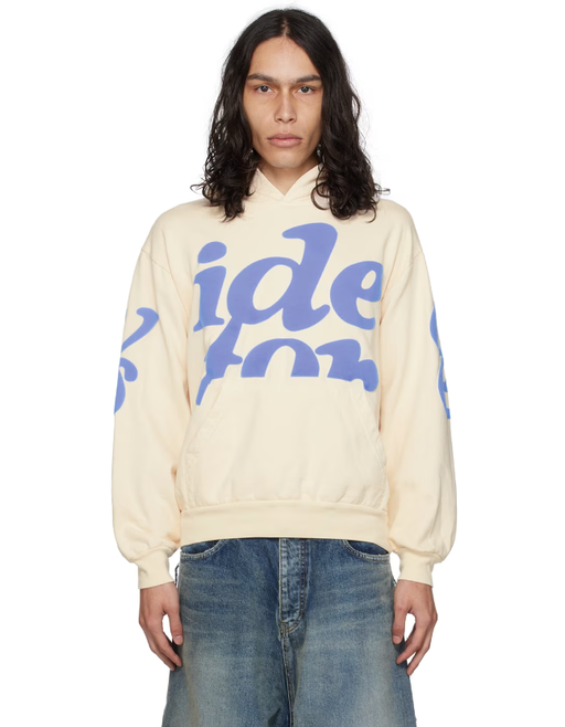 A man wearing VIDEO STORE APPAREL video store apparel off-white mega puff hoodie