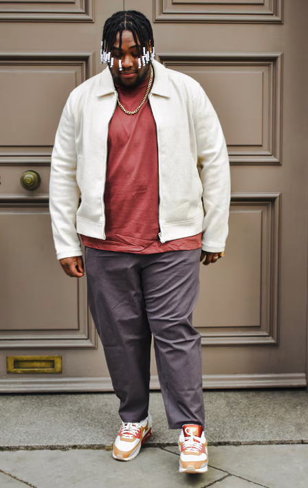 A man wearing a ASOS Curve asos design oversized jacket with crew neck in red