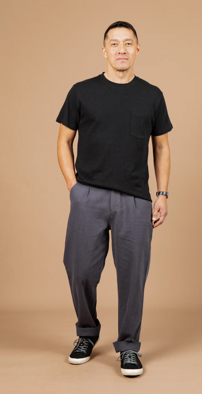 A man wearing Bridge & Burn washed black the organic hemp pocket tee