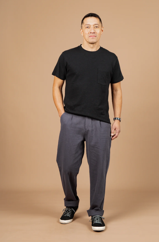 A man wearing Bridge & Burn washed black the organic hemp pocket tee