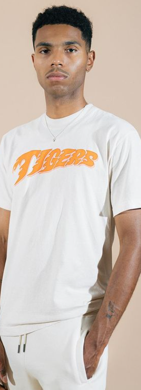 A man wearing Fat Tiger Workshop white t-shirt