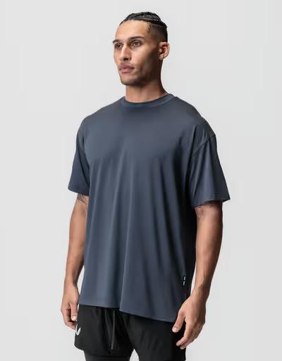 A man wearing asrv aerosilver® oversized tee - navy