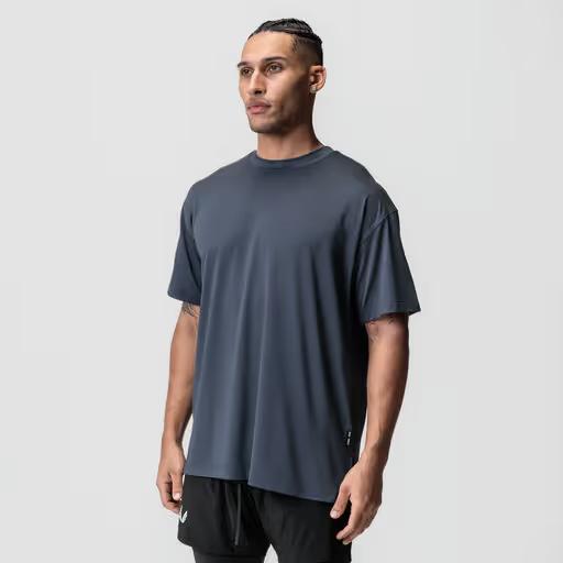 A man wearing asrv aerosilver® oversized tee - navy