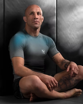 A man wearing hayabusa grey/aqua hayabusa fusion short sleeve rash guard