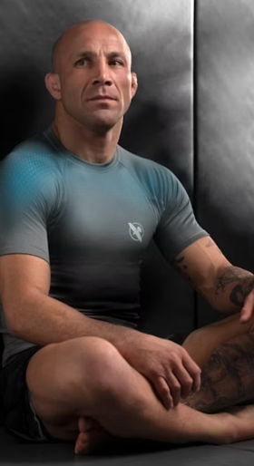 A man wearing hayabusa grey/aqua hayabusa fusion short sleeve rash guard
